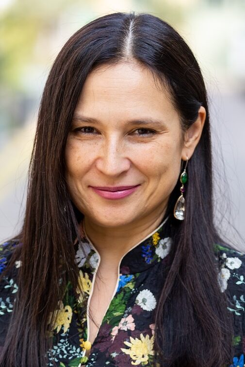 Woman with long, dark, straight hair in Chinese-style dress