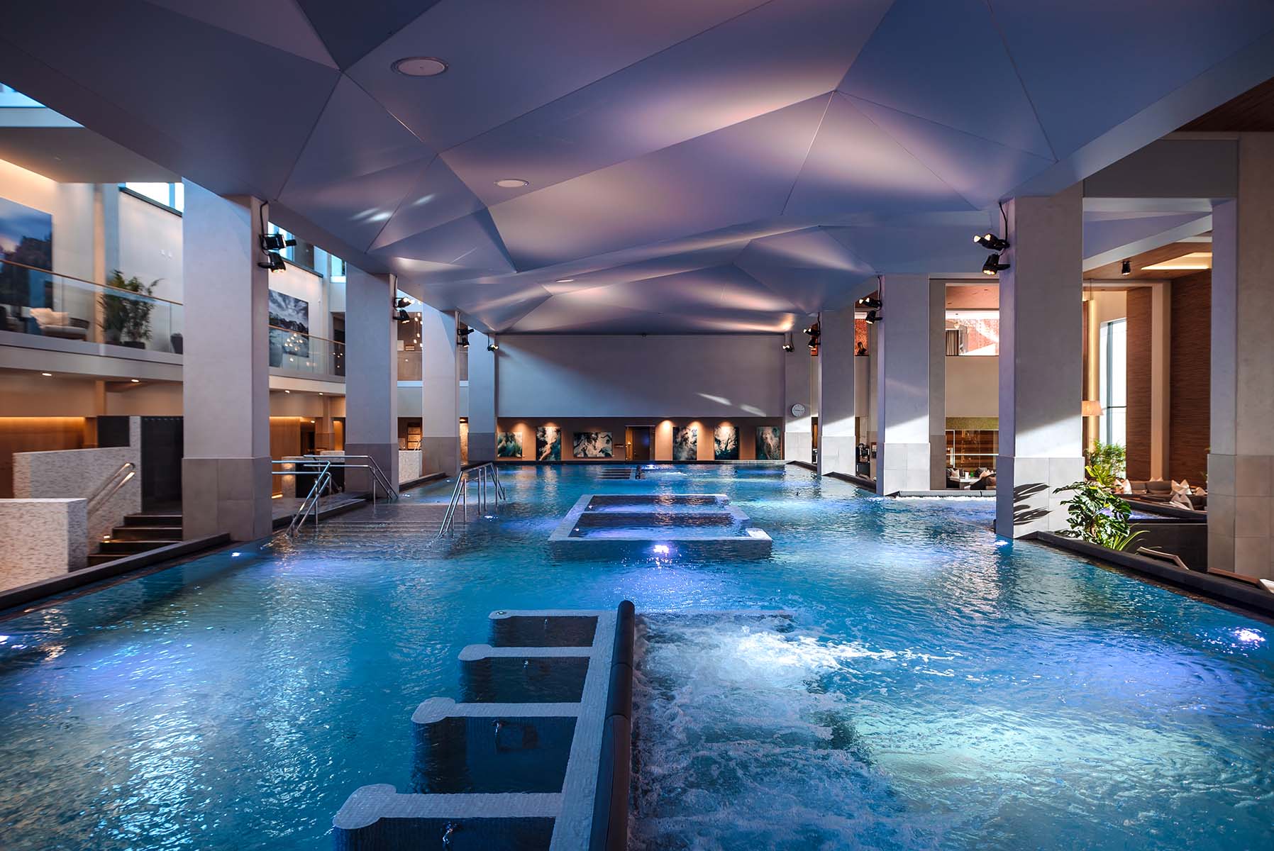 A large indoor swimming pool in a spa