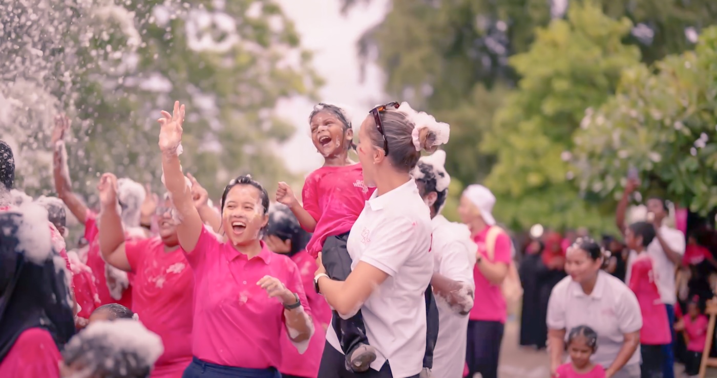 People all wearing pink celebrating
