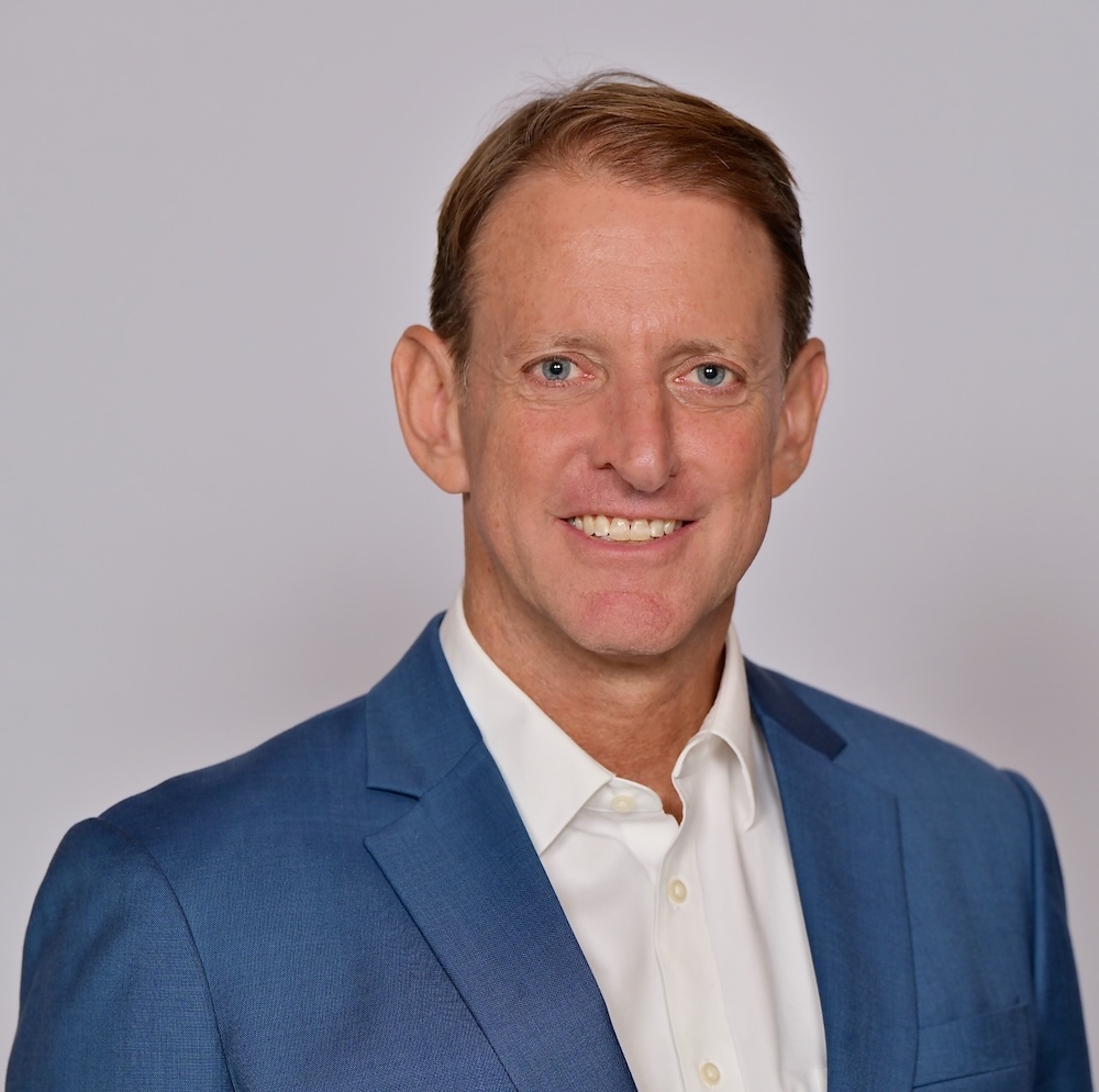 Man in blue jacket and white shirt