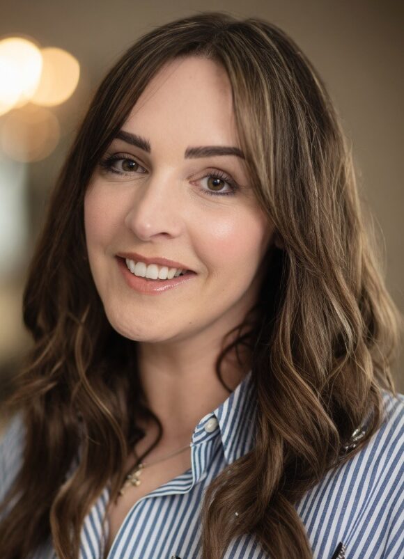 Brown haired woman in blue stripy shirt