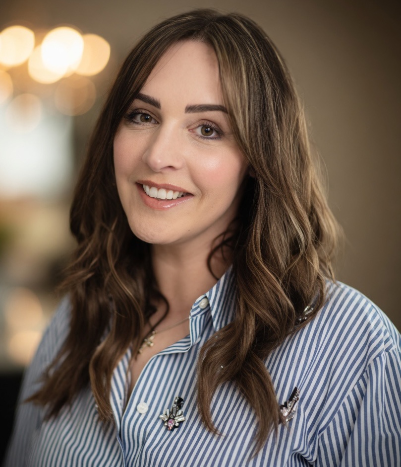 Brown haired woman in blue stripy shirt
