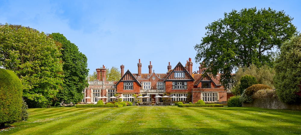 Exterior view of english stately house in the sunshine