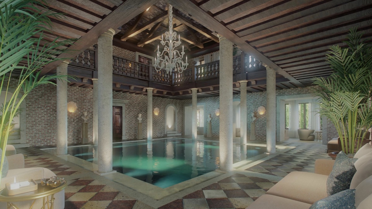 Grand pool in a hotel with columns around it