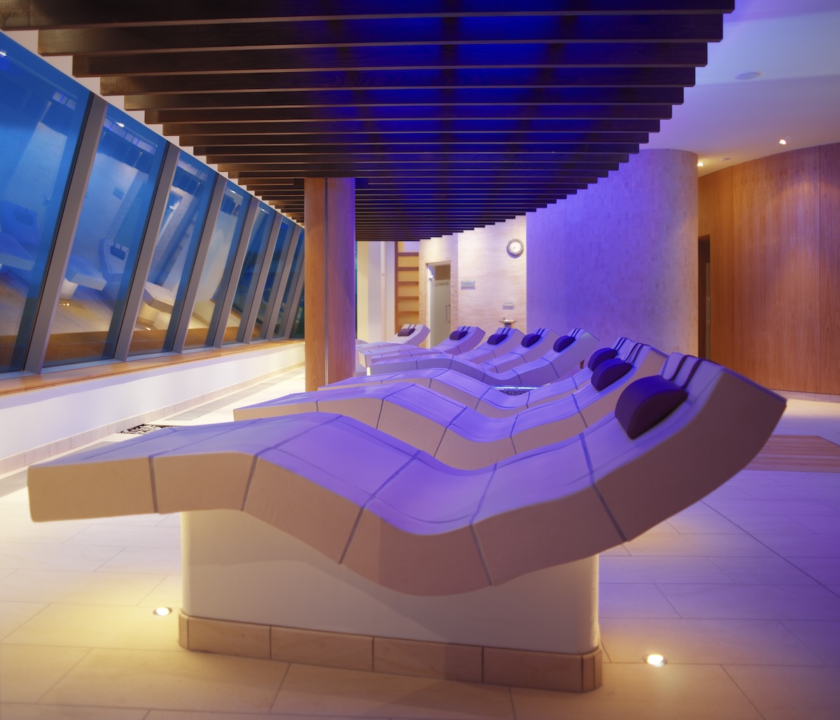 A line of ceramic relaxation loungers in a spa