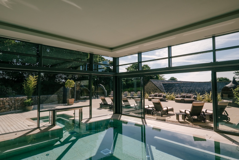 A spa pool overlooking a sunny terrace