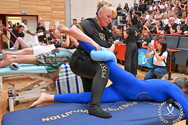 Woman conducting massage at World Championship in Massage 2026