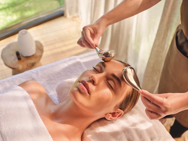 A client enjoying a Jurlique facial treatment in a spa
