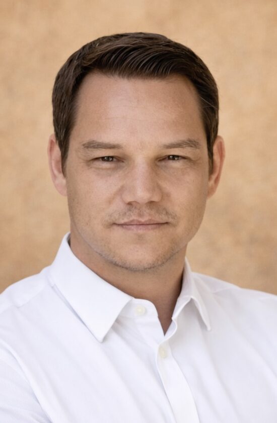 Man in white shirt with dark brown hair