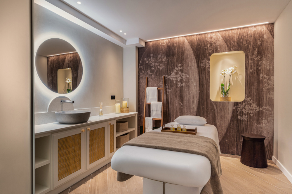 Treatment room is a spa with a therapy bed
