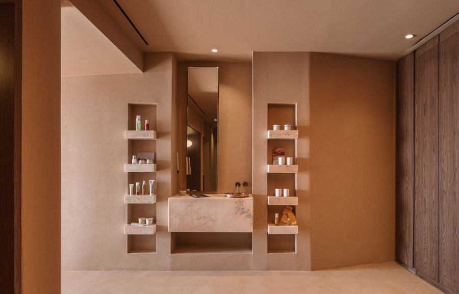 A spa reception area in pale pink tonues