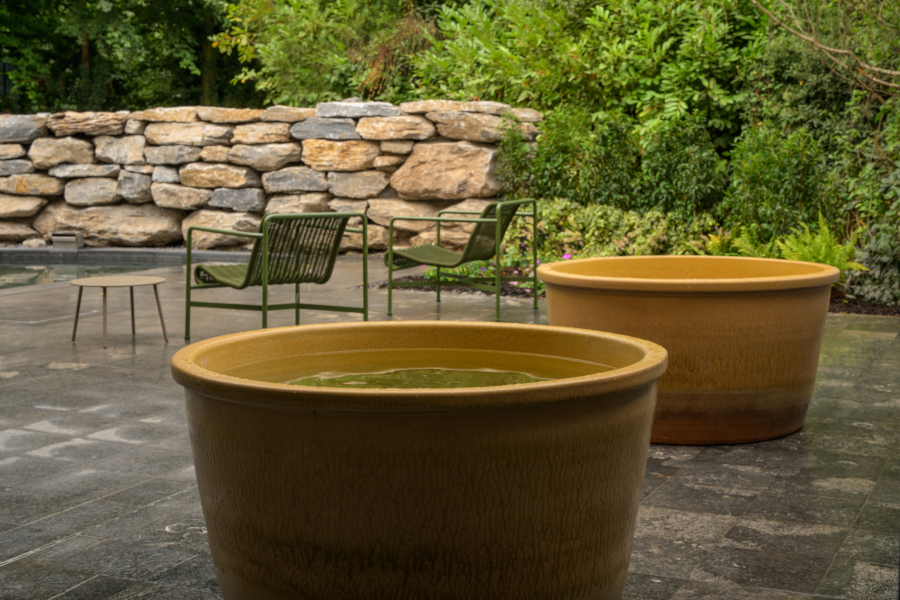 Two ceramic baths for two sat on a stone patio