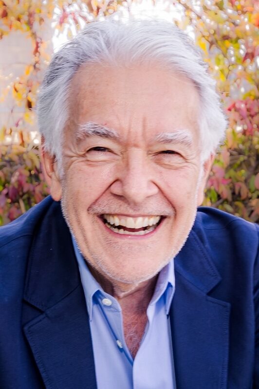 smiling man in blue suit and shirt