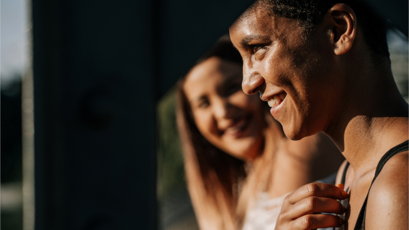 Side profile of two smiling women