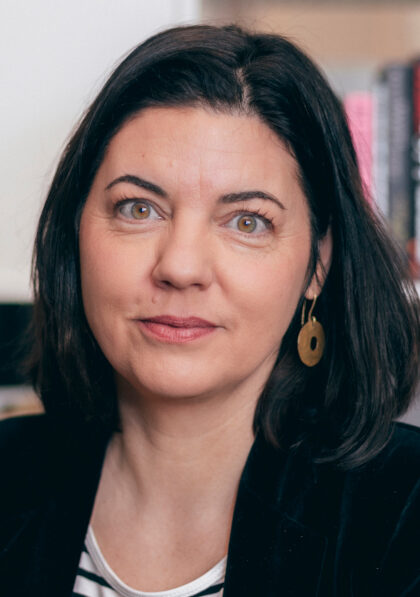 Woman in stripy top with black jacket